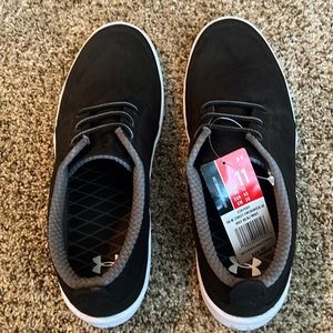 Black men’s under Armour slip ons